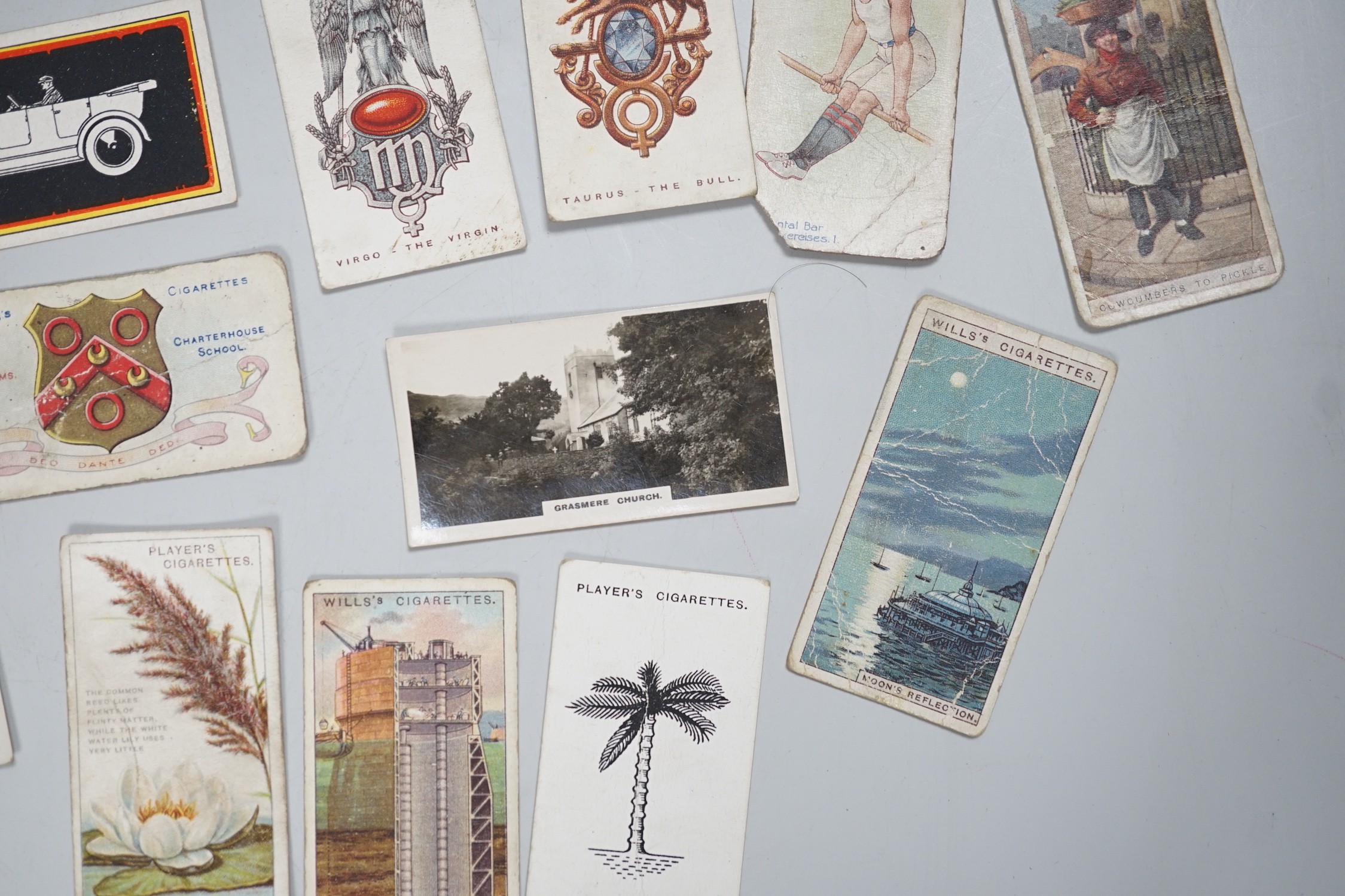 A large collection of mounted and loose cigarette cards